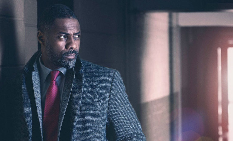 john luther in his coat for shows like luther