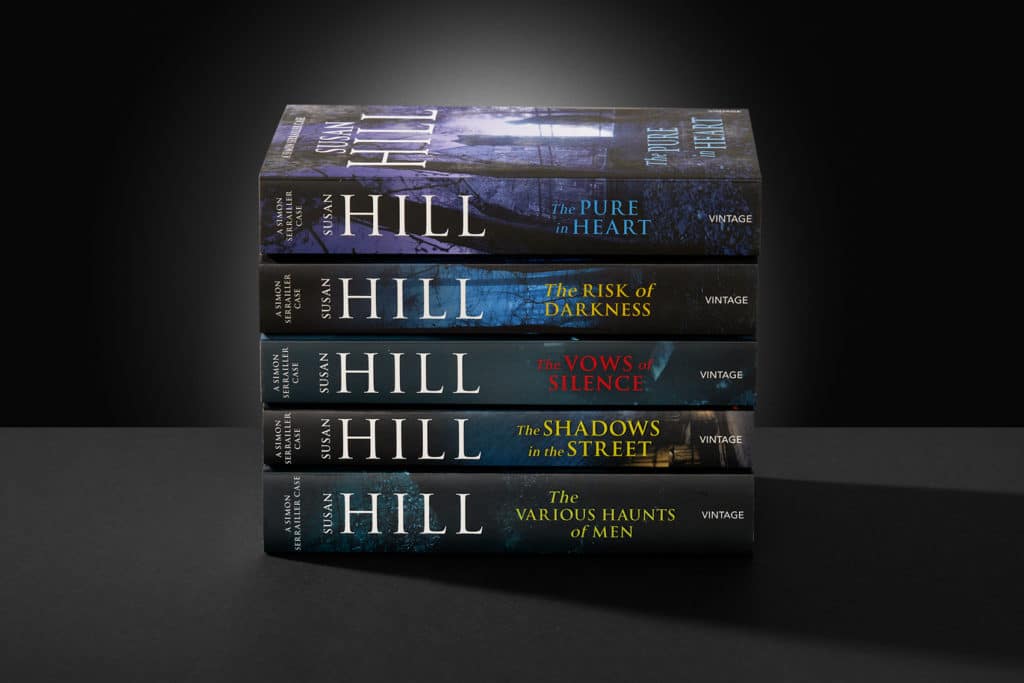 Photo of five Simon Serrailler novels by Susan Hill against a dark backdrop