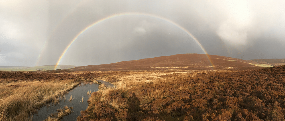 Image of a double rainbow over Orkney taken by Helen Callaghan, author of Night Falls, Still Missing