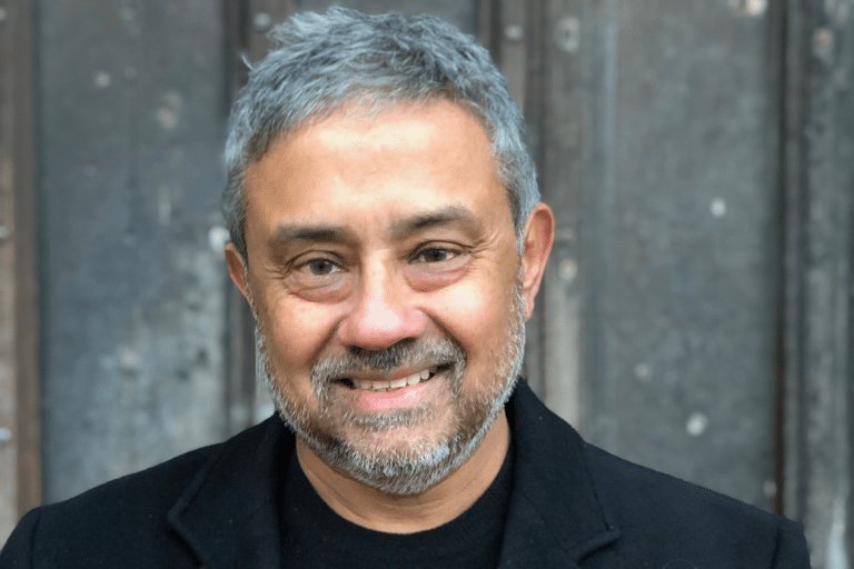 Photo of Ajay Chowdhury, author of the Kamil Rahman series. Read on for all the Kamil Rahman books in order.